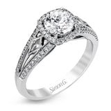 This elegant white gold ring features a lovely vintage style accentuated by .27 ctw of round cut white diamonds and .11 ctw of kite shaped diamonds.