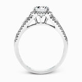 This elegant white gold ring features a lovely vintage style accentuated by .27 ctw of round cut white diamonds and .11 ctw of kite shaped diamonds.