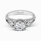 This elegant white gold ring features a lovely vintage style accentuated by .27 ctw of round cut white diamonds and .11 ctw of kite shaped diamonds.