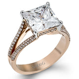 This lovely classic white gold engagement ring is accentuated by .34 ctw of round cut white diamonds in an eye-catching openwork design.