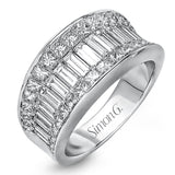 This impressive white gold ring features 1.53 ctw of arresting baguette cut diamonds surrounded by 1.37 ctw princess cut diamonds.