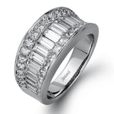 This impressive white gold ring features 1.53 ctw of arresting baguette cut diamonds surrounded by 1.37 ctw princess cut diamonds.