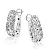 Featuring a classic hoop design, these elegant white gold earrings are complemented by .66 ctw sparkling round cut white diamonds.
