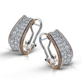 These striking contemporary curved two-tone earrings are set with 2.29 ctw princess cut diamonds complemented by .25 ctw yellow diamonds along the edges.