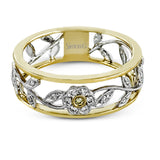Reflecting a charming vintage floral design, this white and yellow gold band is accentuated by .09 ctw round cut white diamonds and .01 ctw round cut yellow diamonds.