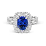 This arresting white gold ring features a classic design set with a 1.90 ctw natural sapphire silhouetted by twin silhouettes accented by .51 ctw of round white diamonds.