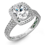 This arresting white gold ring features a classic design set with a 1.90 ctw natural sapphire silhouetted by twin silhouettes accented by .51 ctw of round white diamonds.
