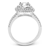 This arresting white gold ring features a classic design set with a 1.90 ctw natural sapphire silhouetted by twin silhouettes accented by .51 ctw of round white diamonds.