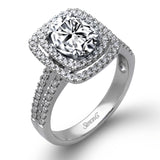 This arresting white gold ring features a classic design set with a 1.90 ctw natural sapphire silhouetted by twin silhouettes accented by .51 ctw of round white diamonds.