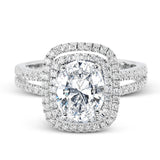 This arresting white gold ring features a classic design set with a 1.90 ctw natural sapphire silhouetted by twin silhouettes accented by .51 ctw of round white diamonds.
