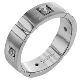 Featuring an impressive contemporary design, this white gold band is inset with .32 ctw of round cut white diamond and rose gold accents.