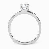 Featuring a modern design, this elegant white gold engagement ring and wedding band set are accentuated by .22 ctw of shimmering round cut white diamonds.