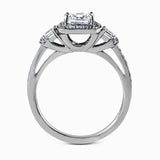 Featuring an intricate design, this white gold engagement ring is emphasized by .26 ctw of round cut white diamonds and .23 ctw of shimmering princess cut white diamonds.