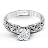 Featuring a delicate floral design, this white gold vintage engagement ring is set with .35 ctw of shimmering white diamonds.