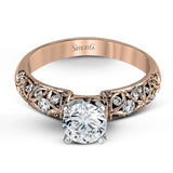 Featuring a delicate floral design, this white gold vintage engagement ring is set with .35 ctw of shimmering white diamonds.