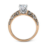 Featuring a delicate floral design, this white gold vintage engagement ring is set with .35 ctw of shimmering white diamonds.