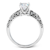 Featuring a delicate floral design, this white gold vintage engagement ring is set with .35 ctw of shimmering white diamonds.