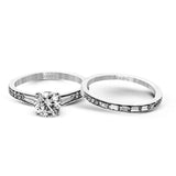 This dazzling white gold wedding set is enhanced by .21 ctw round cut white diamonds with side accents of .53 ctw of baguette cut diamonds.