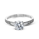 This dazzling white gold wedding set is enhanced by .21 ctw round cut white diamonds with side accents of .53 ctw of baguette cut diamonds.