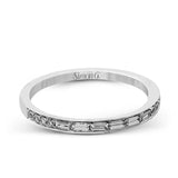 This dazzling white gold wedding set is enhanced by .21 ctw round cut white diamonds with side accents of .53 ctw of baguette cut diamonds.