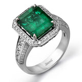 A classic, this 18K white gold ring showcases a 3.52ct emerald and .61cttw white diamonds.