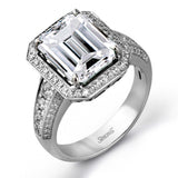 A classic, this 18K white gold ring showcases a 3.52ct emerald and .61cttw white diamonds.