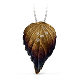 Featuring an incredibly delicate and realistic leaf design, this pendant is set with .04 ctw of sparkling round white diamonds.