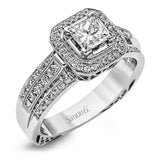 Presenting a vintage-inspired design, this white gold ring is accented by .23 ctw round cut white diamonds and .23 ctw princess cut diamonds.