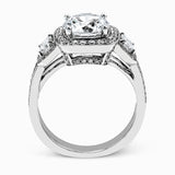 The dazzling contemporary design of this white gold engagement ring is emphasized by .44 ctw round cut white diamonds and .45 ctw emerald cut white diamonds.