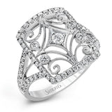 The intricate design of this vintage style white gold ring is enhanced by .64 ctw of glistening round cut white diamonds.