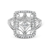 The intricate design of this vintage style white gold ring is enhanced by .64 ctw of glistening round cut white diamonds.