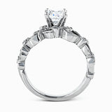 This delicate floral inspired white gold engagement ring and wedding band set is accentuated with .28 ctw shimmering round cut white diamonds.