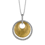 This striking contemporary pendant features an eye-catching geometric design in white and yellow gold accented with .43 ctw round cut white diamonds.