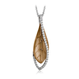 A modern leaf design pendant in 18K yellow gold suspended in a line of white diamonds 0.32 ctw, 19 adjustable chain