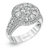 This spectacular ring features a Simon Set center feature with 1.85 ctw of custom-cut diamonds that fit perfectly together. The rest of the ring contains .72 ctw of round diamonds.