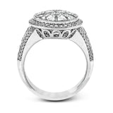 This spectacular ring features a Simon Set center feature with 1.85 ctw of custom-cut diamonds that fit perfectly together. The rest of the ring contains .72 ctw of round diamonds.