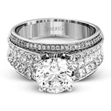 Presenting an eye-catching contemporary design, this white gold engagement ring features 1.31 ctw of princess cut white diamonds accented by .21 ctw of round cut white diamonds.