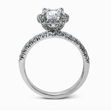 This elegant classic white gold halo engagement ring and band is set with .78 ctw of sparkling round cut white diamonds.