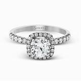This elegant classic white gold halo engagement ring and band is set with .78 ctw of sparkling round cut white diamonds.