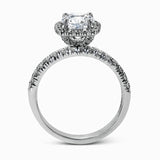 This elegant classic white gold halo engagement ring and band is set with .78 ctw of sparkling round cut white diamonds.