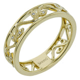 An intricate floral design highlights this classic white and yellow gold ring accentuated by .04 ctw of elegant round cut white diamonds.