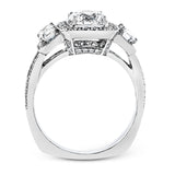 This impressive white gold ring features .43 ctw emerald cut side diamonds and is accented with .38 ctw round cut diamonds.