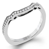 This impressive white gold ring features .43 ctw emerald cut side diamonds and is accented with .38 ctw round cut diamonds.