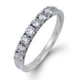 Elegantly simple, this classically styled white gold band is accented by the presence of .50 ctw of shimmering round cut white diamonds.