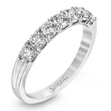 Elegant in its simplicity, this brilliant classically-styled platinum band is set with .75 ctw striking round cut white diamonds.