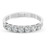 Elegant in its simplicity, this brilliant classically-styled platinum band is set with .75 ctw striking round cut white diamonds.