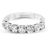 Featuring a dazzling classic design, this platinum band is accentuated by a row of 1.50 ctw sparkling round cut white diamonds.