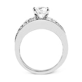 This eye-catching contemporary white gold engagement ring is accented by .75 ctw round cut white diamonds and 1.26 ctw baguette white diamonds for an unforgettable look.
