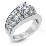 This eye-catching contemporary white gold engagement ring is accented by .75 ctw round cut white diamonds and 1.26 ctw baguette white diamonds for an unforgettable look.