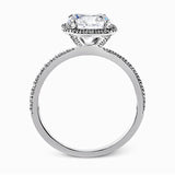 Featuring a contemporary take on a vintage style, this white gold engagement ring and band is complemented by .50 ctw of striking round cut white diamonds.